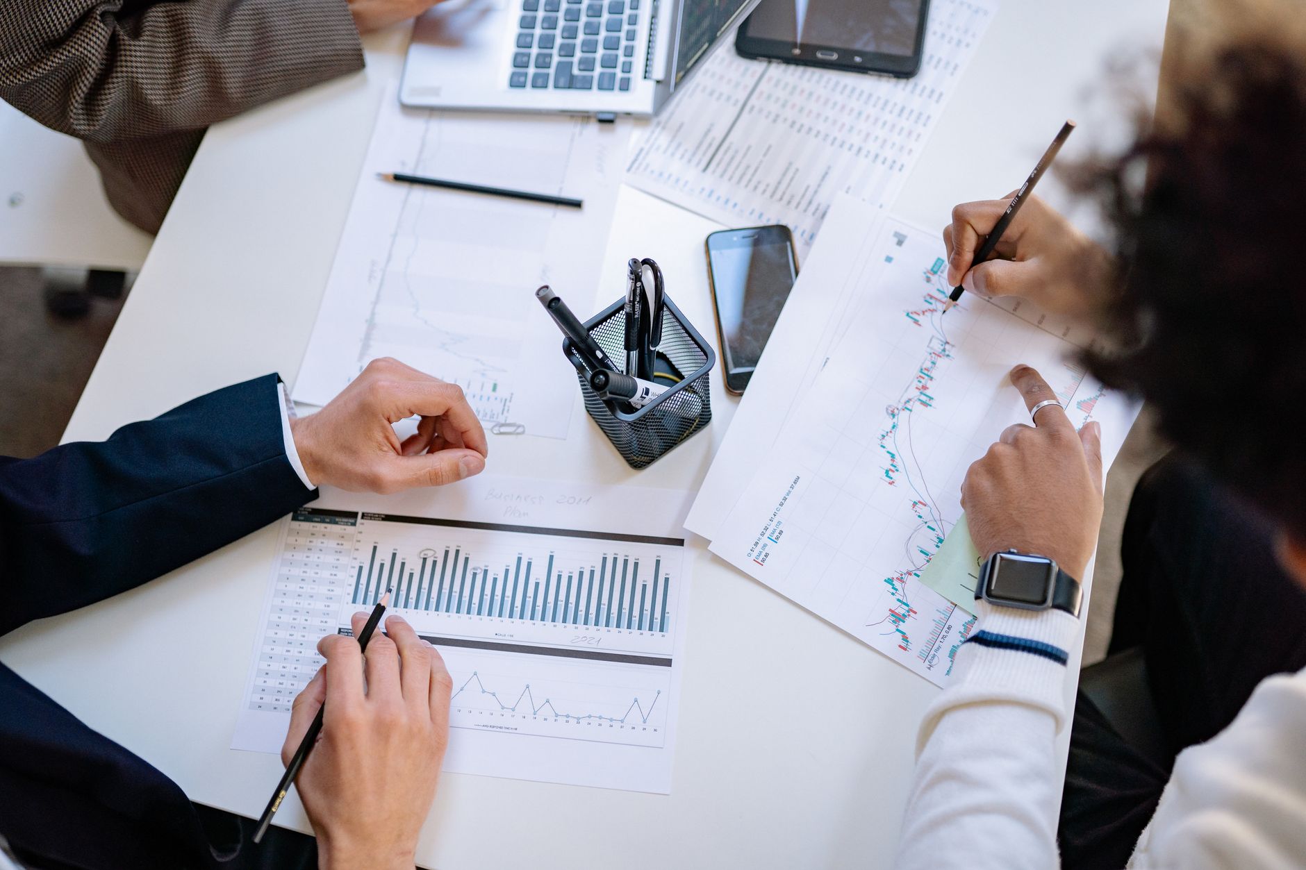 Business team reviewing financial documents in a UK office