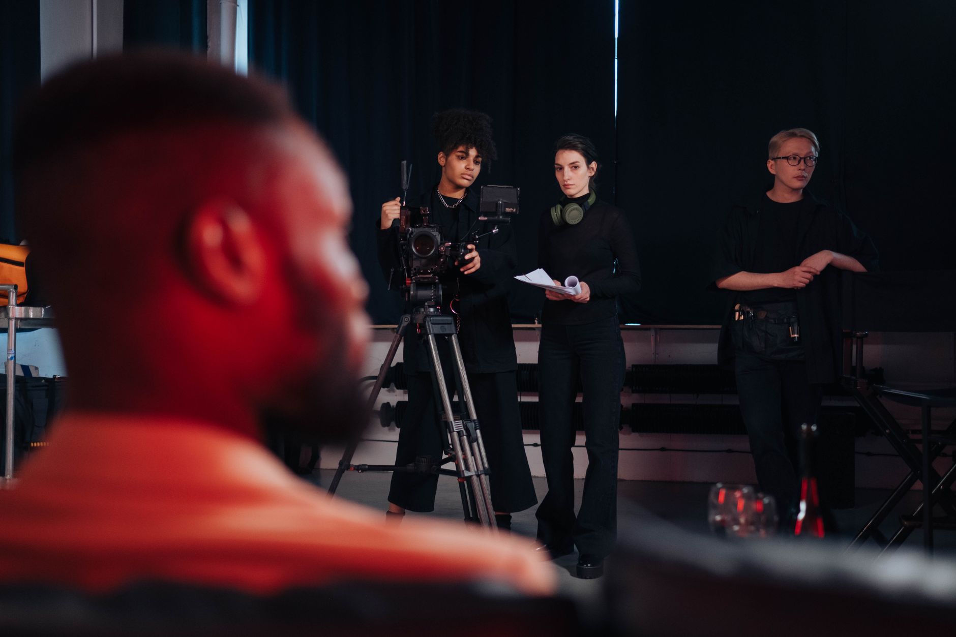 Film crew setting up cameras and equipment during a production.