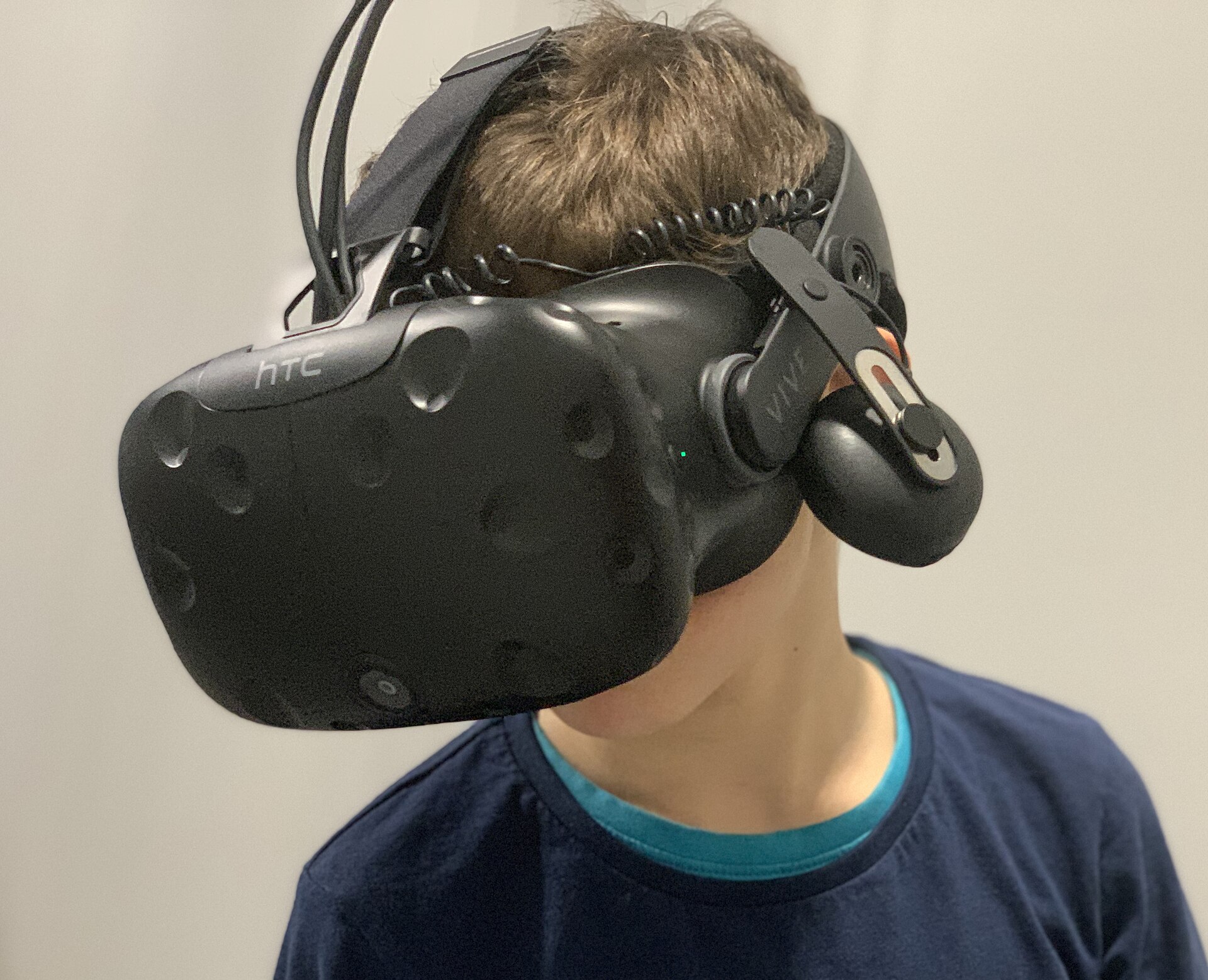 A 7-year-old boy wearing a virtual reality headset