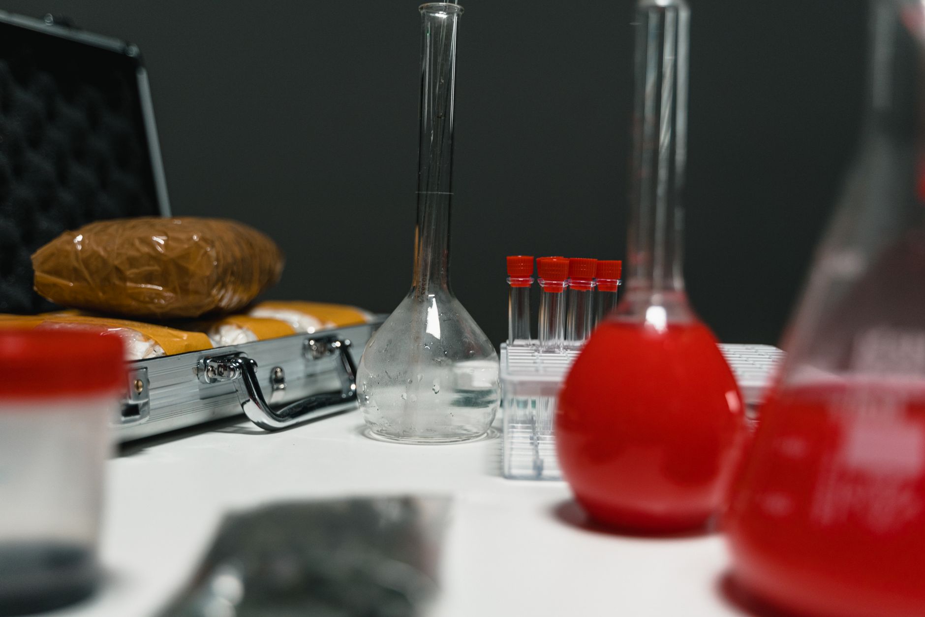 Laboratory glassware and samples in a science lab environment, focusing on research and chemistry.