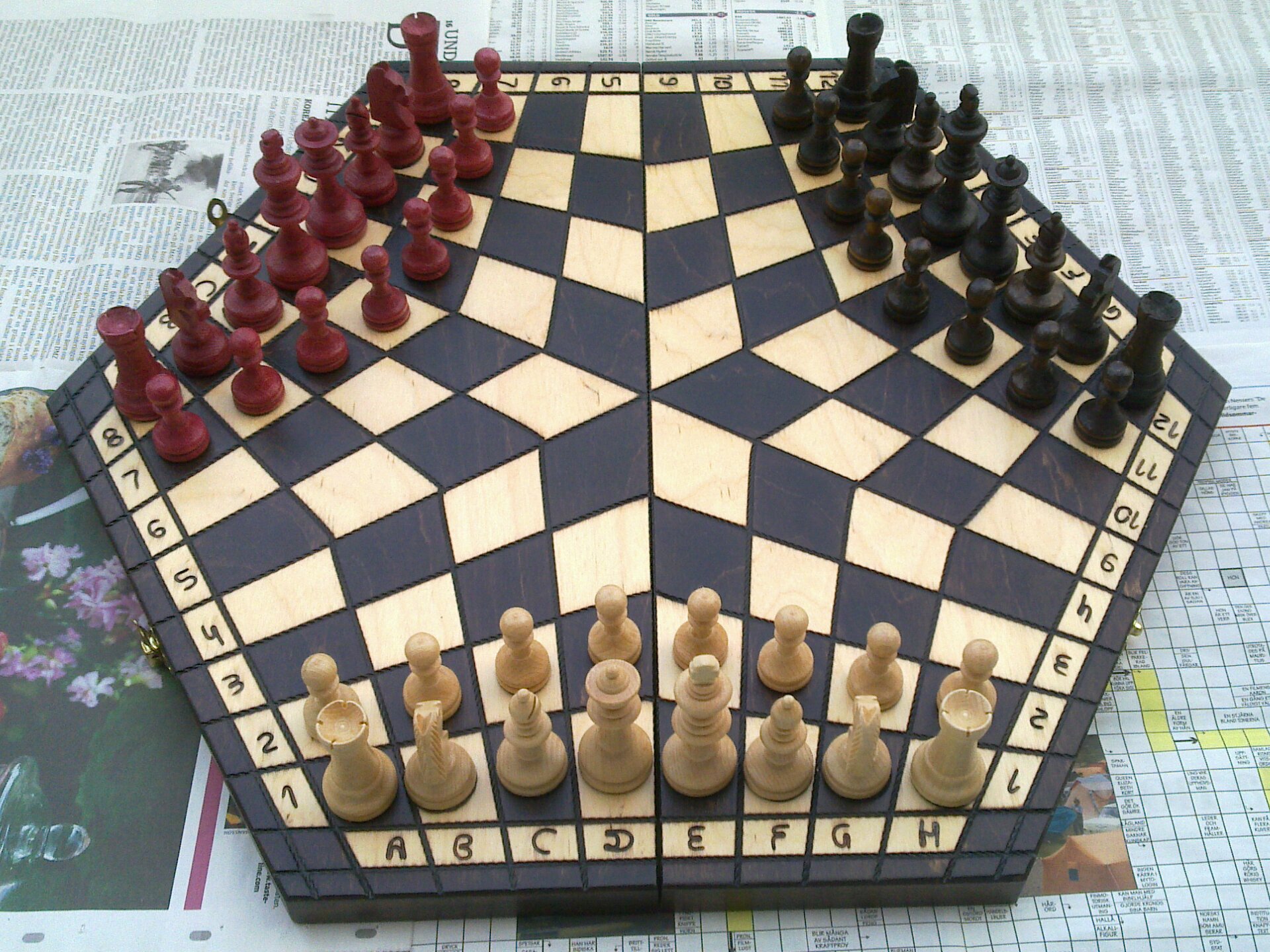 Hexagonal board for three-handed chess .