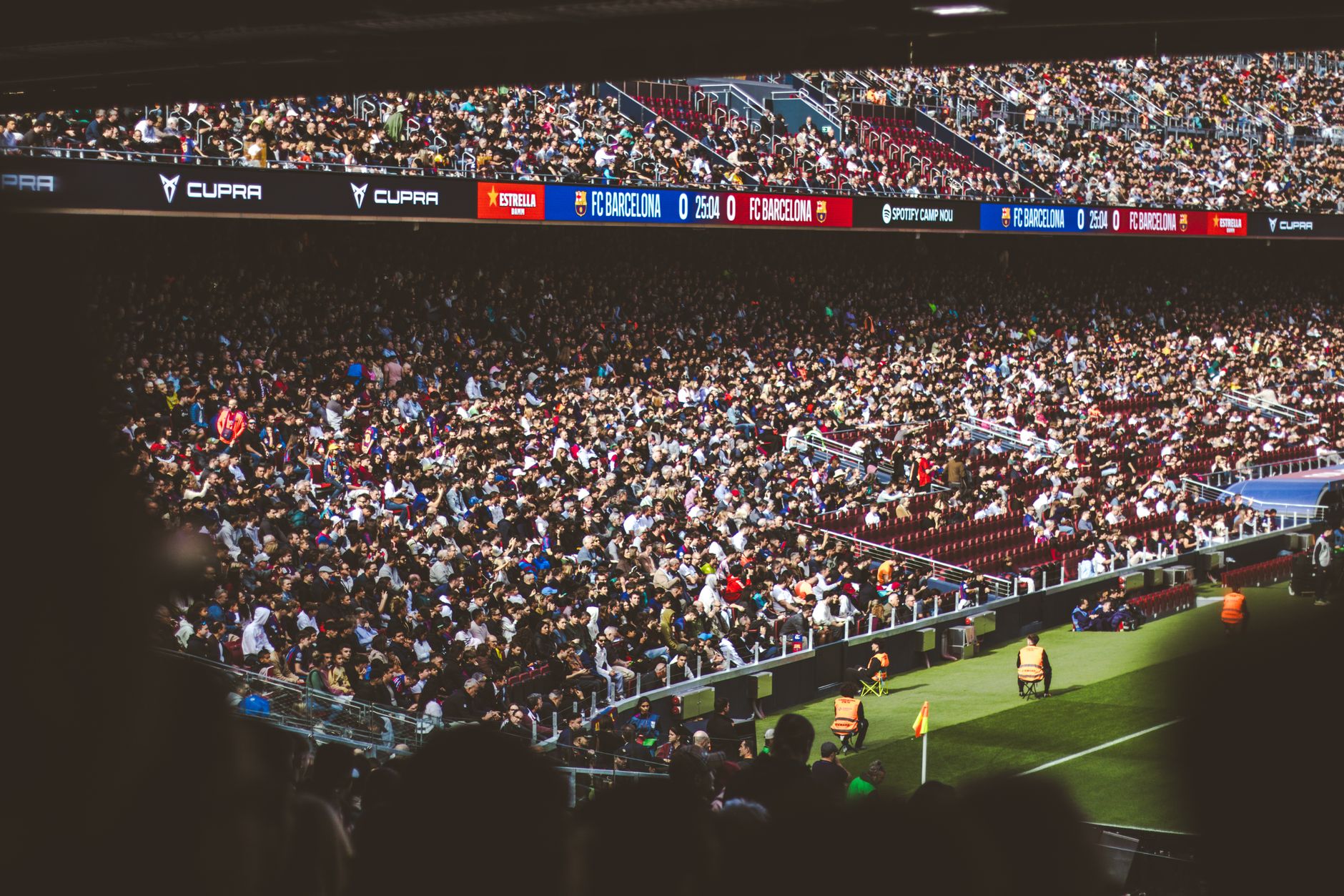 A bustling crowd enjoying a football match at Camp Nou Stadium, Barcelona.