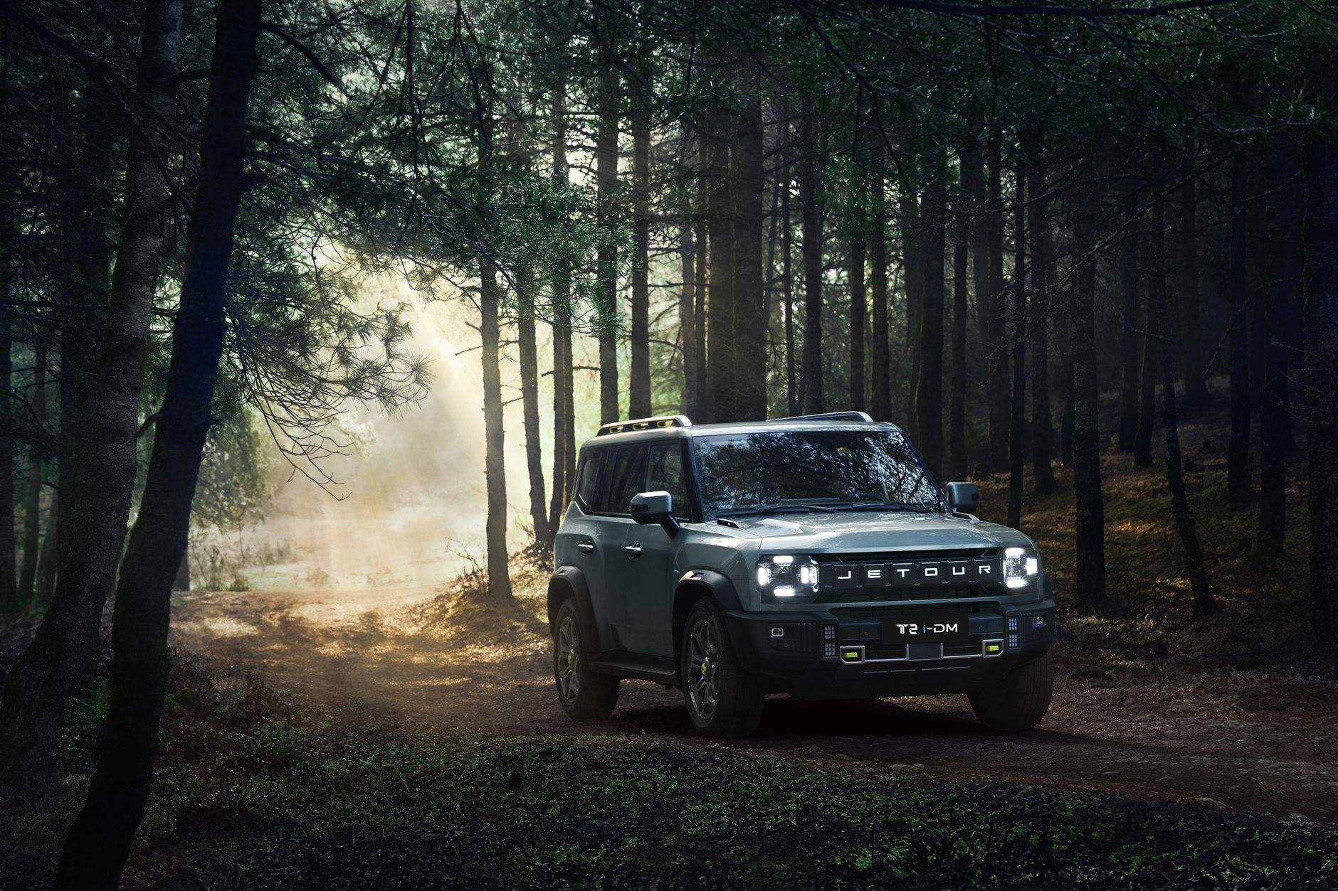 Adventure-ready Jetour T2 SUV driving through a misty forest trail in Georgia. Perfect for off-road exploration.