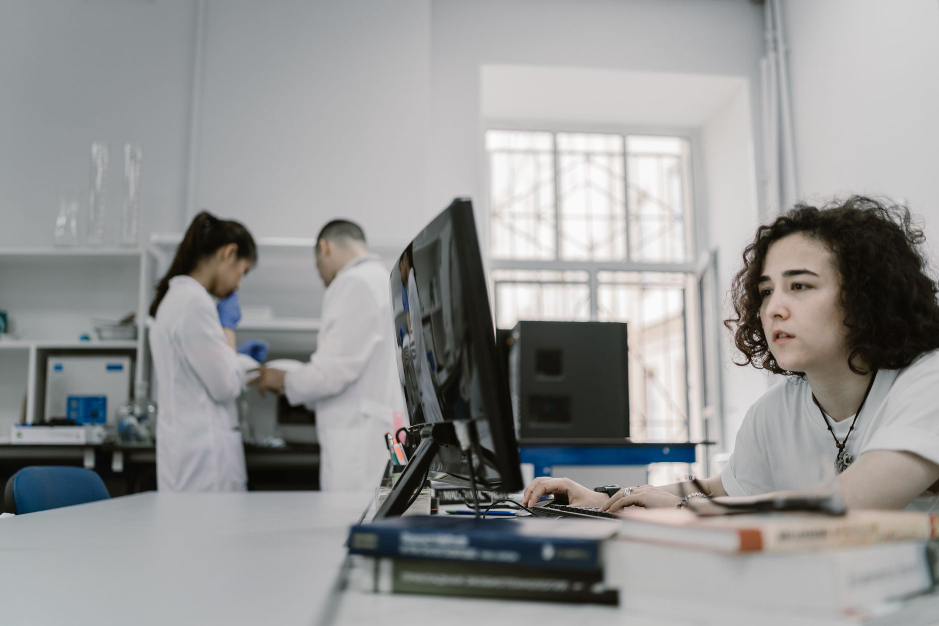 Researcher reviewing scientific data visualizations on a computer screen